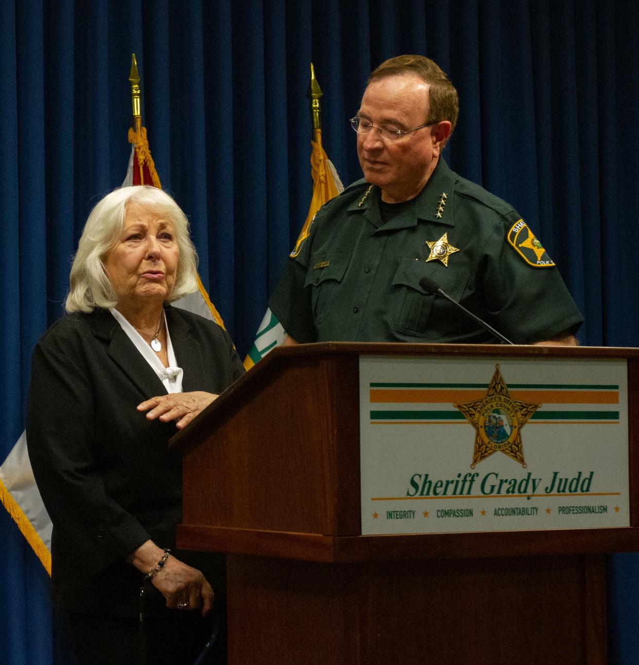 Betty Scalf, the mother of Teresa Scalf, stands with Polk County Sheriff Grady Judd at a news conference Monday. Judd announced that Donald Douglas had been identified as the murderer of Teresa Scalf in 1986.