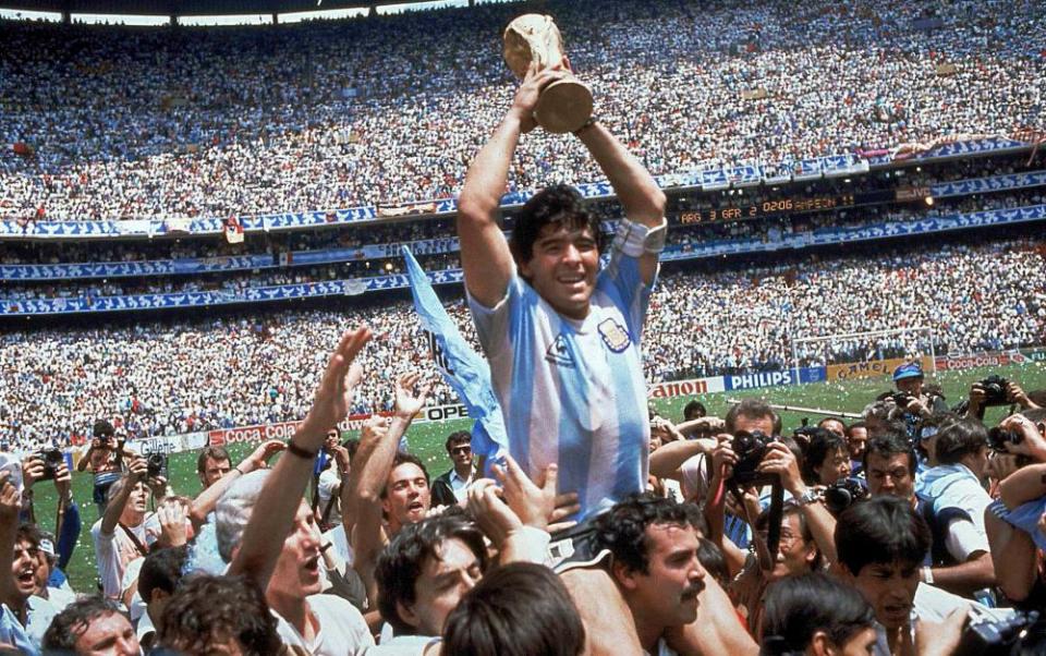 Maradona holds the World Cup trophy after Argentina’s defeat of West Germany in the final in Mexico City in 1986.