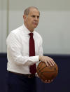 Cleveland Cavaliers head coach John Beilein talks with players before a news conference, Tuesday, May 21, 2019, in Independence, Ohio. Beilein left Michigan after a successful 12-year run for what will likely be his last coaching stop, the Cleveland Cavaliers, who believe the 66-year-old can accelerate their rebuild. (AP Photo/Tony Dejak)