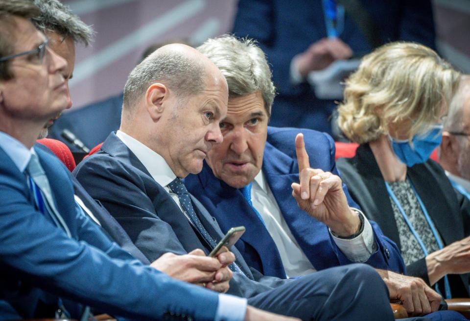 U.S. climate envoy John Kerry speaks with German Chancellor Olaf Scholz at the U.N. climate change conference, known as COP27, on Nov. 7, 2022, in Egypt. <a href="https://www.gettyimages.com/detail/news-photo/november-2022-egypt-scharm-el-scheich-german-chancellor-news-photo/1244584482" rel="nofollow noopener" target="_blank" data-ylk="slk:Michael Kappeler/picture alliance via Getty Images;elm:context_link;itc:0;sec:content-canvas" class="link ">Michael Kappeler/picture alliance via Getty Images</a>