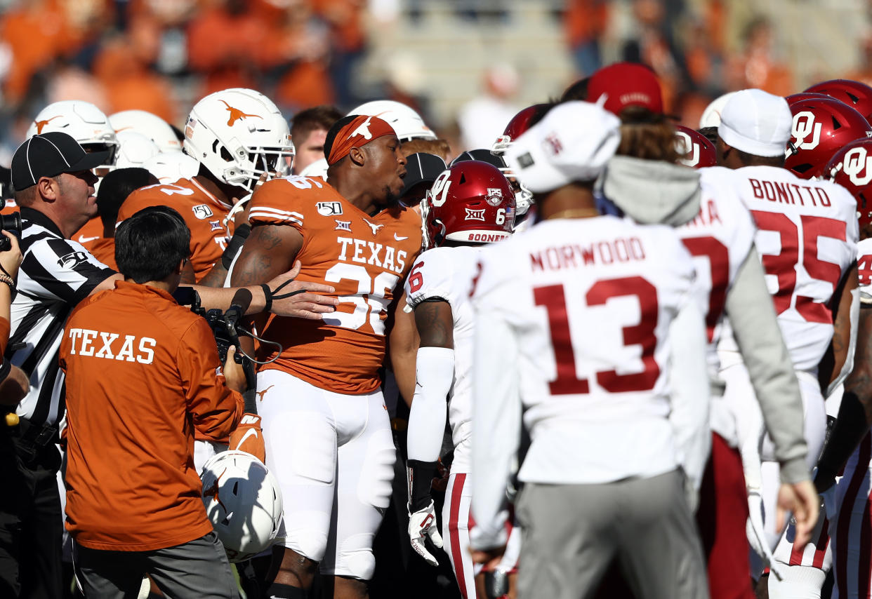 Both Texas and Oklahoma got flagged ahead of their big rivalry game. (Photo by Ronald Martinez/Getty Images)