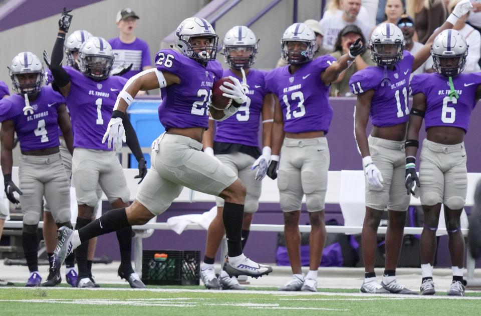 St. Thomas running back Shawn Shipman (26) rushes the ball in the first quarter of an NCAA college football game against Michigan Tech Saturday, Sept. 10, 2022 at O'Shaughnessy Stadium in St. Paul, Minn. (Anthony Souffle/Star Tribune via AP)