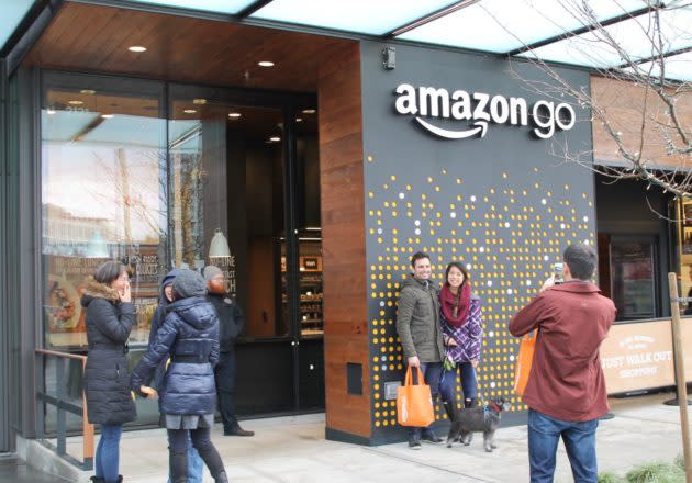 People posed in front of the Amazon Go sign as testers tried out the new service. (GeekWire Photo / Nat Levy)