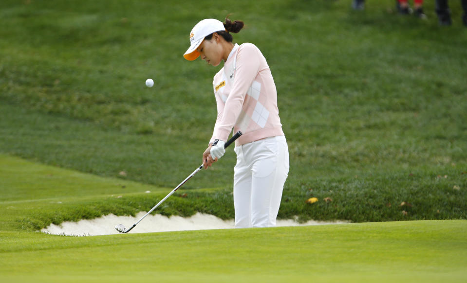 In Gee Chun hits out of a bunker at the first hole during the third round of the Cognizant Founders Cup golf tournament Saturday, Oct. 9, 2021, in West Caldwell, N.J. (AP Photo/Noah K. Murray)