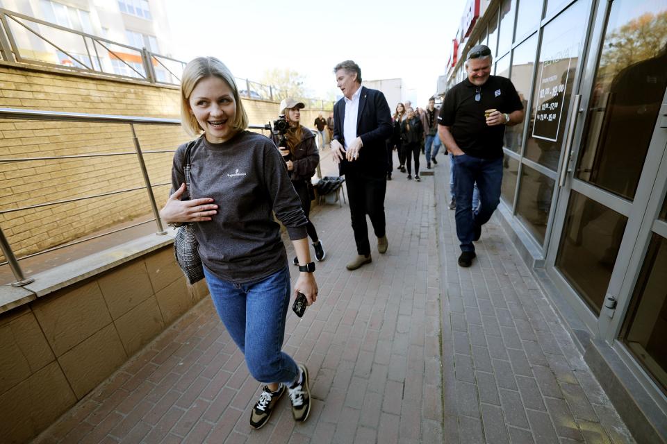 Viktoriia Tarasiuk, country manager for Ukraine and director of the August Mission Foundation of Ukraine, talks with friends and delegation members as they walk toward their small warehouse in Kyiv, Ukraine, on Monday, May 1, 2023. | Scott G Winterton, Deseret News