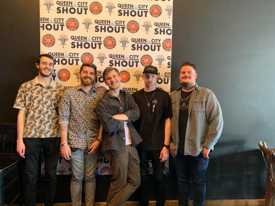 From left to right, Chris Mathisen, Carter Williams, Thomas Yonke, Payton Anderson and Jack Barnhart pose for a photo during Queen City Shout at The Cellar. The five make up The Wandering Found, a rock band based in Springfield. The band is in the quarterfinals of Audacy's Opening Act competition. The winner will perform as the opening act at the Hollywood Bowl on Oct. 22.