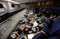 <p>Seventeen student survivors from Marjory Stoneman Douglas High School lie down on the floor in silence and pray at the approximate time of the attack one week ago, inside the state capitol, in Tallahassee, Fla., Wednesday, Feb. 21, 2018. (Photo: Gerald Herbert/AP) </p>