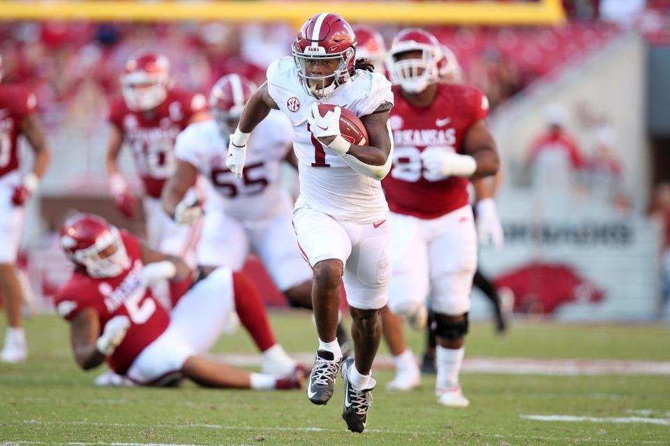 Alabama running back Jahmyr Gibbs (1) rushes for a touchdown in the fourth quarter against Arkansas at Donald W. Reynolds Razorback Stadium.