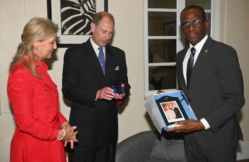 CASTRIES, SAINT LUCIA - APRIL 22: Sophie, Countess of Wessex, Prince Edward, Earl of Wessex and Philip Pierre, Prime Minister of Saint Lucia present gifts to each other during a reception on day one of their Platinum Jubilee Royal Tour of the Caribbean at the Prime Minister’s Residence on April 22, 2022 in Castries, Saint Lucia. The Earl and Countess of Wessex are touring the region for one week, with visits to Antigua and Barbuda, St Lucia, and St Vincent and the Grenadines. The tour forms part of Queen Elizabeth II's Platinum Jubilee celebrations.  (Photo by Stuart C. Wilson/Getty Images)