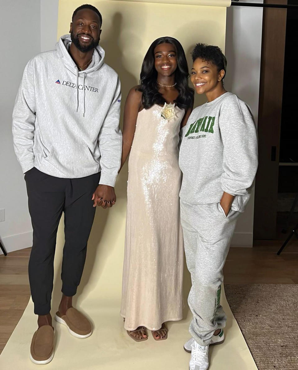 Dwayne Wade stands beside Zaya Wade and Gabrielle Union for a formal photo. (@gabunion and @dwyanewade via Instagram)