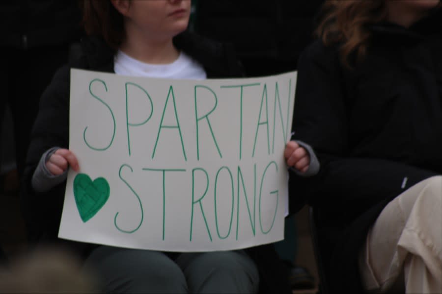 Protester at the Michigan Capitol holds a sign “Spartan Strong,” a moniker created in the wake of last year’s mass shooting. (WLNS)