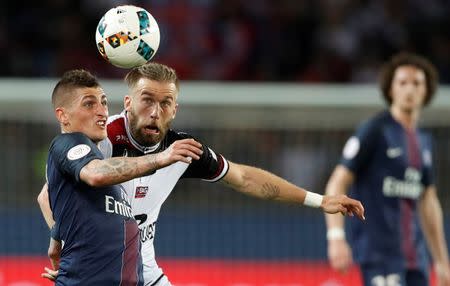 Football Soccer - Paris St Germain v Guingamp - French Ligue 1 - Parc des Princes, Paris, France - 9/4/17. Paris St Germain's Marco Verratti and Guingamp's Lucas Deaux in action. REUTERS/Gonzalo Fuentes