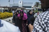 Family members of passengers who were flying aboard an EgyptAir plane that vanished from radar en route from Paris to Cairo, are transported to a gathering point at Cairo airport, on May 19, 2016