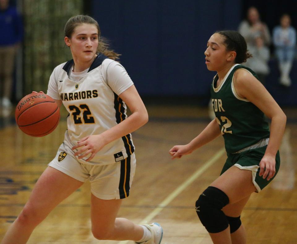 Lourdes' Simone Pelish looks to drive against Roosevelt guard Yadi Smith during a Feb. 1, 2023 girls basketball game.