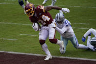 Washington Football Team running back Antonio Gibson (24) scores a touchdown against Dallas Cowboys cornerback Trevon Diggs (27) in the first half of an NFL football game, Sunday, Oct. 25, 2020, in Landover, Md. (AP Photo/Susan Walsh)