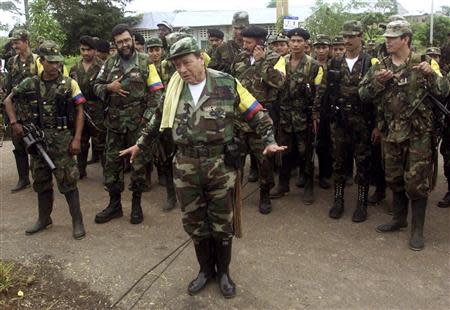 Colombian commander Manuel "Sureshot" Marulanda Velez of the Revolutionary Armed Forces of Colombia (FARC) talks to reporters in Los Pozos, Caqueta province, in this February 9, 2001 file photo. REUTERS/Jose Miguel Gomez/Files