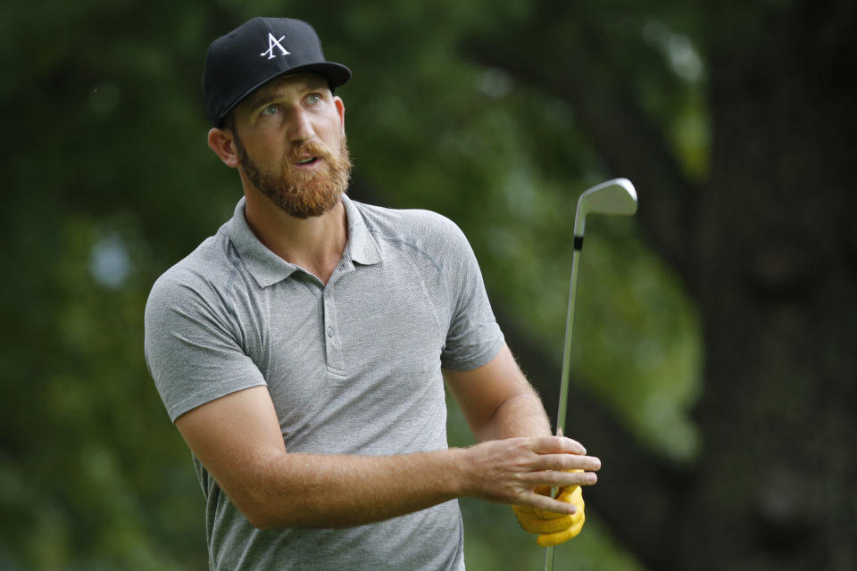 Kevin Chappell watches his tee shot on the ninth hole during the second round of A Military Tribute at The Greenbrier golf tournament in White Sulphur Springs, W.Va., Friday, Sept. 13, 2019. (AP Photo/Steve Helber)