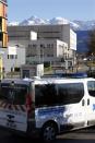 An ambulance is seen in front of the CHU Nord hospital in Grenoble, French Alps, where retired seven-times Formula One world champion Michael Schumacher is hospitalized after a ski accident, December 30, 2013. Former Formula One champion Michael Schumacher was battling for his life in hospital on Monday after a ski injury, doctors said, adding it was too early to say whether he would pull through. Schumacher was admitted to hospital on Sunday suffering head injuries in an off-piste skiing accident in the French Alps resort of Meribel. REUTERS/Charles Platiau (FRANCE - Tags: SPORT MOTORSPORT HEALTH)