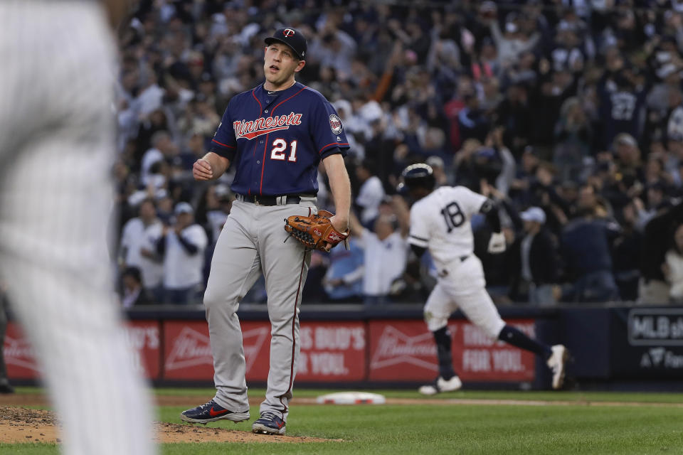 Minnesota Twins relief pitcher Tyler Duffey (21) reacts after giving up a grand slam home run to New York Yankees' Didi Gregorius during the third inning of Game 2 of an American League Division Series baseball game, Saturday, Oct. 5, 2019, in New York. (AP Photo/Frank Franklin)