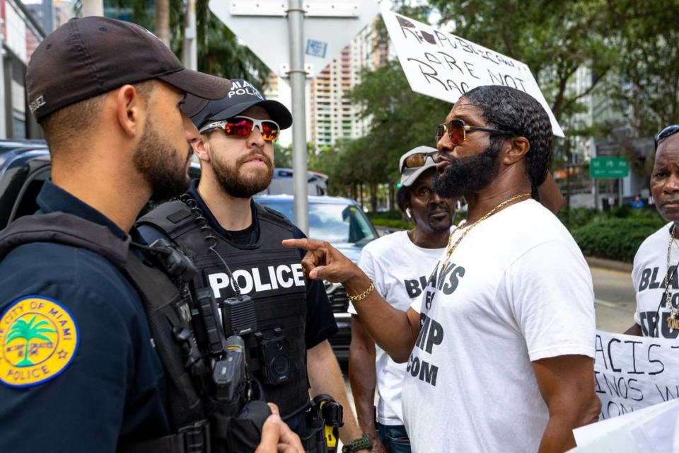 Blacks for Trump activist Maurice Symonette thanks City of Miami Police Officers for their service outside the Four Seasons Hotel in the Brickell business district of Miami, Florida, on Wednesday, May 24, 2023.