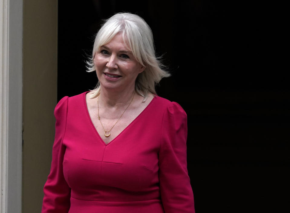 British MP Nadine Dorries smiles as she leaves 10 Downing Street, in London, Wednesday, Sept. 15, 2021. British Prime Minister Boris Johnson is shaking up his Cabinet as he attempts to move on from a series of political missteps and U-turns. Johnson's office said he would appoint "a strong and united team to build back better from the pandemic." (AP Photo/Alberto Pezzali)