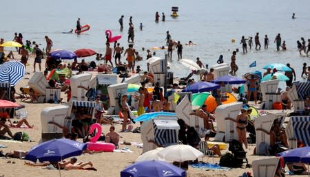 People cool off as temperatures reach new record highs at Berlin's Wannsee lido