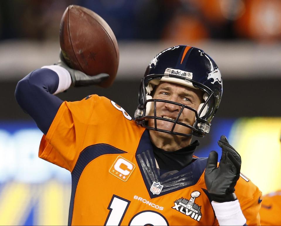 Denver Broncos quarterback Peyton Manning warms up on the field before the NFL Super Bowl XLVIII football game against the Seattle Seahawks Sunday, Feb. 2, 2014, in East Rutherford, N.J. (AP Photo/Evan Vucci)