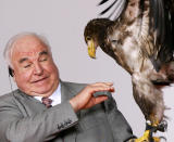 <p>Former German Chancellor Kohl reacts as an eagle sits on his hand during the ‘Point Alpha Award’ ceremony near the village of Geisa. Former German Chancellor Helmut Kohl reacts as an eagle sits on his hand during the ‘Point Alpha Award’ ceremony at the cold war-era U.S. Army observation post point Alpha at the demarcation line between East and West Germany near the village of Geisa, east Germany June 17, 2005. Bush received the inaugural ‘Point Alpha Award’, that honours outstanding contributions to German and European unity along with Kohl and Gorbachev on Friday, the anniversary of a 1953 workers uprising against Communist authorities in East Germany. (REUTERS/Fabrizio Bensch) </p>