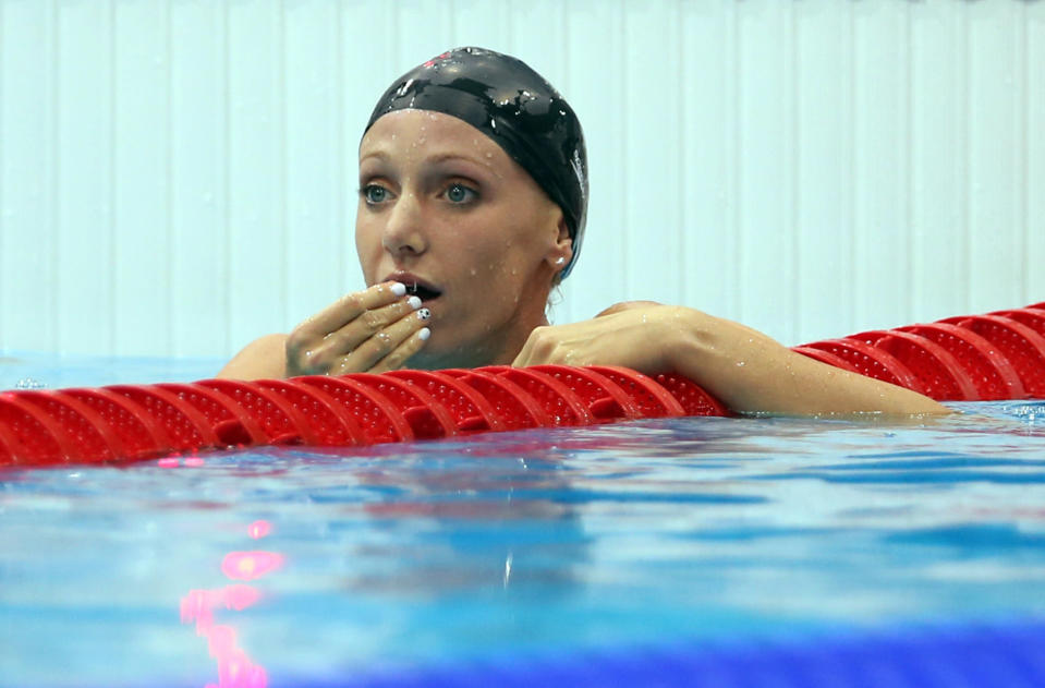 LONDON, ENGLAND - JULY 29: Dana Vollmer of the United States celebrates after winning the gold medal and setting a new world record in the Womans 100m Butterfly during the 2012 London Olympics at the Aquatics Centre on July 29, 2012 in London, England. (Photo by Ian MacNicol/Getty Images)