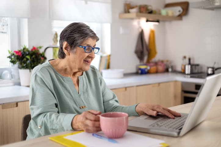 A senior looking up her Social Security increase. 