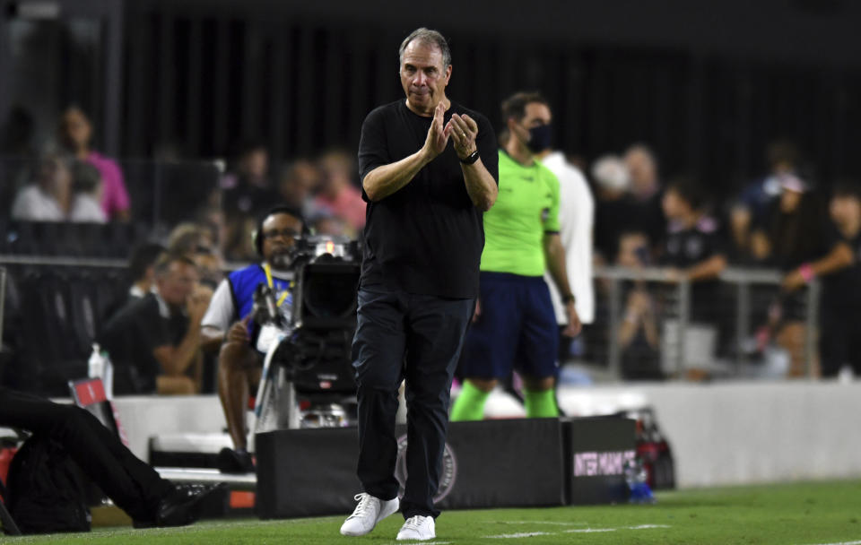 FILE - New England Revolution head coach Bruce Arena applauds his team during the second half of an MLS soccer match against Inter Miami, Wednesday, July 21, 2021, in Fort Lauderdale, Fla. Bruce Arena won a record fourth Major League Soccer Coach of the Year award on Monday, Nov. 29, after leading the New England Revolution to a league-record 73 points.(AP Photo/Jim Rassol, File)