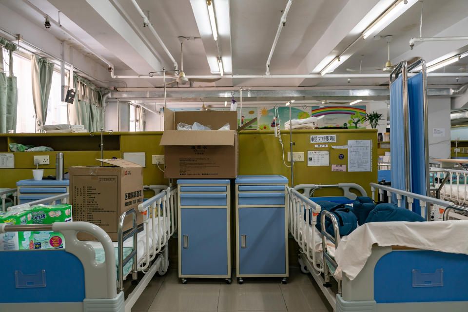Boxes of supplies pile up on beds normally reserved for residents requiring special care, Kei Tak (Tai Hang) Home for the Aged, on May 6.<span class="copyright">Anthony Kwan for TIME</span>