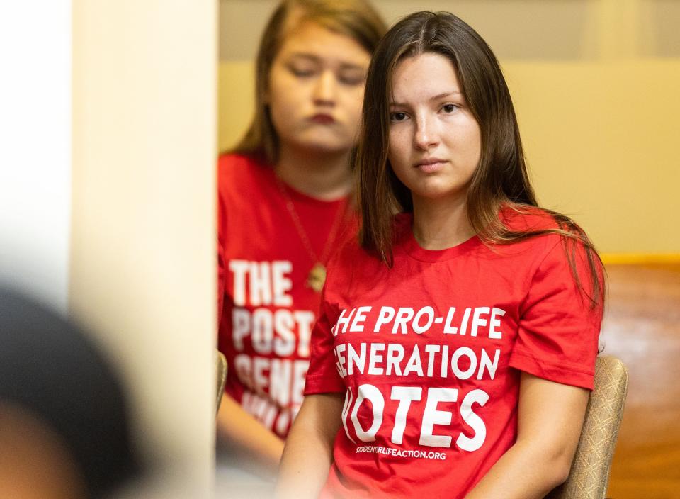 A woman sits in the Supreme Court audience wearing a shirt that reads ÒThe pro-life generation votes,Ó during a hearing on the 15-week abortion ban in Florida on Friday, Sept. 8, 2023.