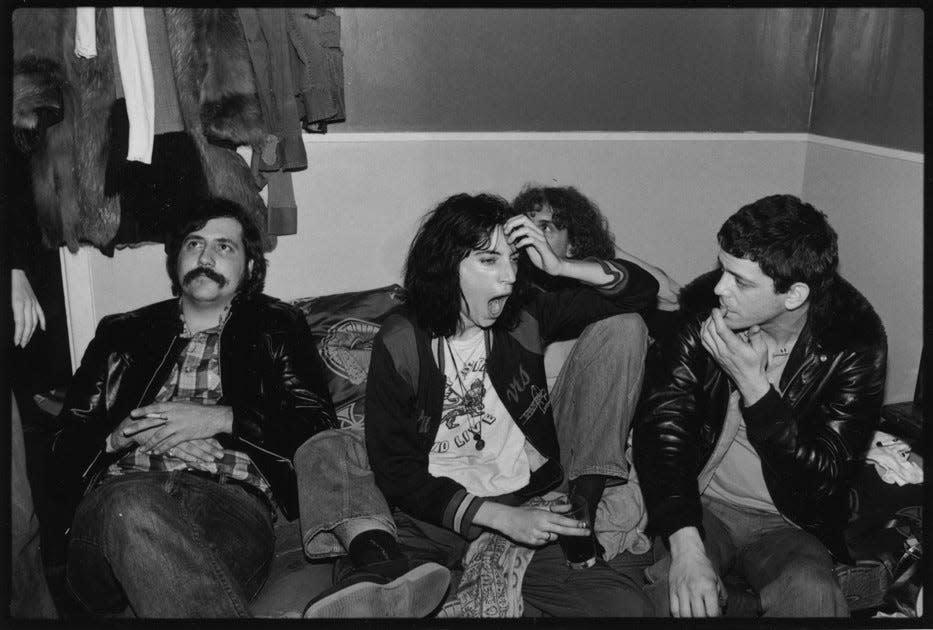 Lester Bangs, left, with Patti Smith and Lou Reed at New York's Bottom Line club in 1975.