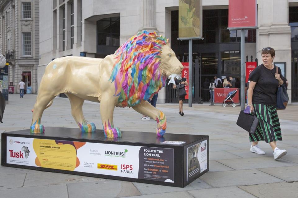 The lion statue designed by John Cleese and Jen Wade in Trafalgar Square, central London part of the Tusk Lion Trail which aims to raise awareness about threats to the animal’s existence and conservation efforts to help the species (Joshua Bratt/PA) (PA Wire)