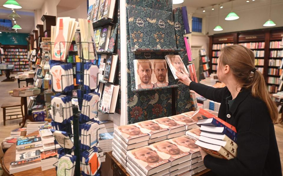 A bookseller stocks copies of Prince Harry's book Spare in Daunt Books London - JUSTIN TALLIS/AFP via Getty Images