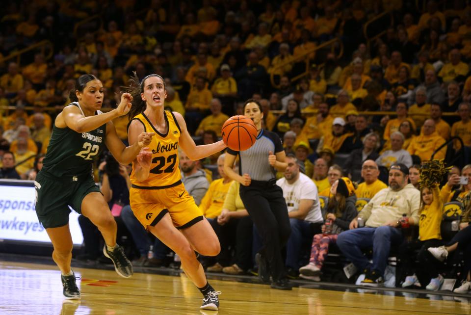 Iowa’s Caitlin Clark (22) drives to the basket defended by Michigan State’s Moira Joiner (22) Tuesday, Jan. 2, 2024 at Carver-Hawkeye Arena. Julia Hansen/Iowa City Press-Citizen / USA TODAY NETWORK