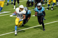 Los Angeles Chargers running back Austin Ekeler (30) runs for a touchdown past Carolina Panthers free safety Tre Boston (33) and outside linebacker Jeremy Chinn (21) during the first half of an NFL football game Sunday, Sept. 27, 2020, in Inglewood, Calif. (AP Photo/Ashley Landis )