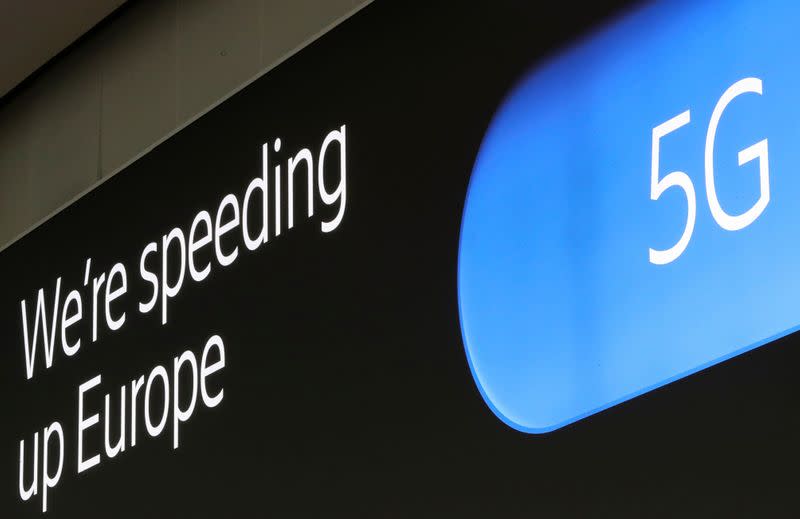 FILE PHOTO: An advertising board shows a 5G logo at the International Airport in Zaventem