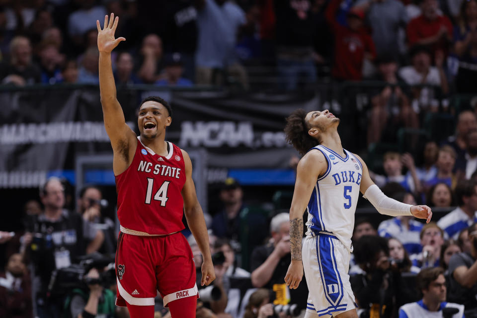 North Carolina State's Casey Morsell (14) and Duke's Tyrese Proctor (5) react during the second half of an Elite Eight college basketball game in the NCAA Tournament in Dallas, Sunday, March 31, 2024. (AP Photo/Brandon Wade)