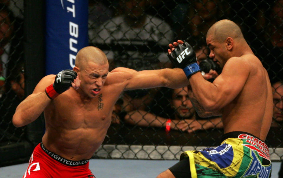 11 July 2009: Georges St-Pierre of Canada on left and Thiago Alves of Brazil exchange punches during their welterweight fight at the UFC 100 event at the Mandalay Bay Events Center in Las Vegas, NV. St-Pierre wins by unanimous decision over Alves in the fifth round. (Photo by Cliff Welch/Icon SMI/Icon Sport Media via Getty Images)