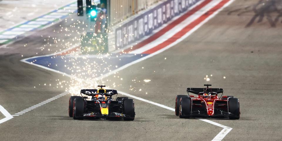 F1 drivers Charles Leclerc of Ferrari and Max Verstappen of Red Bull battle during the 2022 Bahrain Grand Prix.