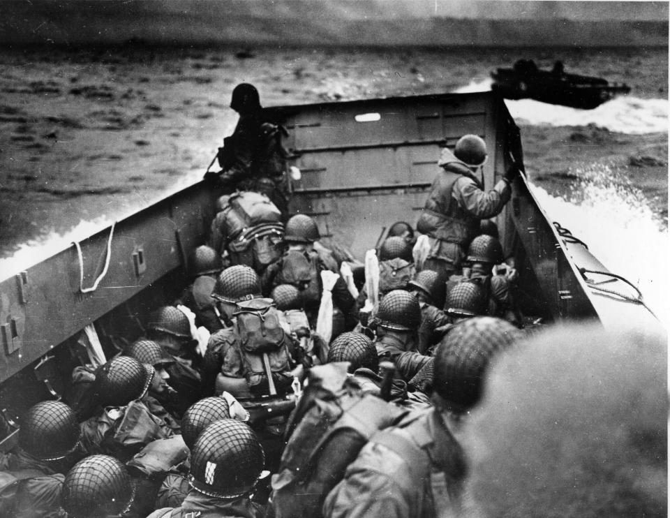 FILE - In this photo provided by the U.S. Coast Guard, a U.S. Coast Guard landing barge, tightly packed with helmeted soldiers, approaches the shore at Normandy, France, during initial Allied landing operations, June 6, 1944. The D-Day invasion that helped change the course of World War II was unprecedented in scale and audacity. Veterans and world dignitaries are commemorating the 79th anniversary of the operation. (U.S. Coast Guard via AP, File)