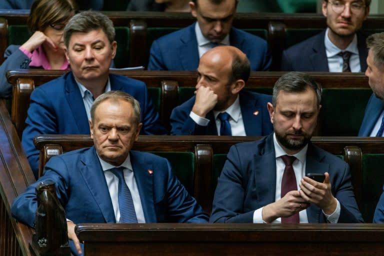 The hotly-anticipated vote was a test for the governing alliance of Polish Prime Minister Donald Tusk (L), as some coalition lawmakers were reluctant to back the legislation (Wojtek Radwanski)