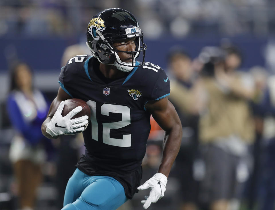 Jacksonville Jaguars wide receiver Dede Westbrook (12) takes a Blake Bortles pass into the end zone for a touchdown in the second half of an NFL football game against the Dallas Cowboys in Arlington, Texas, Sunday, Oct. 14, 2018. (AP Photo/Jim Cowsert)