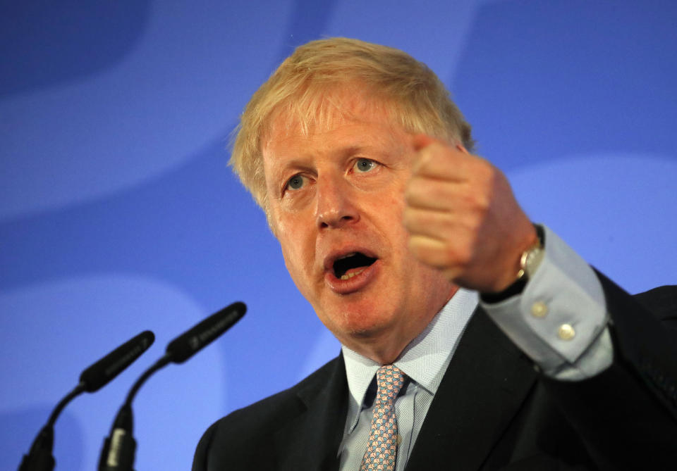 Britain's Conservative Party lawmaker Boris Johnson gestures as he speaks during the official launch of his leadership campaign, in London, Wednesday June 12, 2019. Boris Johnson solidified his front-runner status in the race to become Britain's next prime minister on Tuesday, gaining backing from leading pro-Brexit lawmakers.(AP Photo/Frank Augstein)