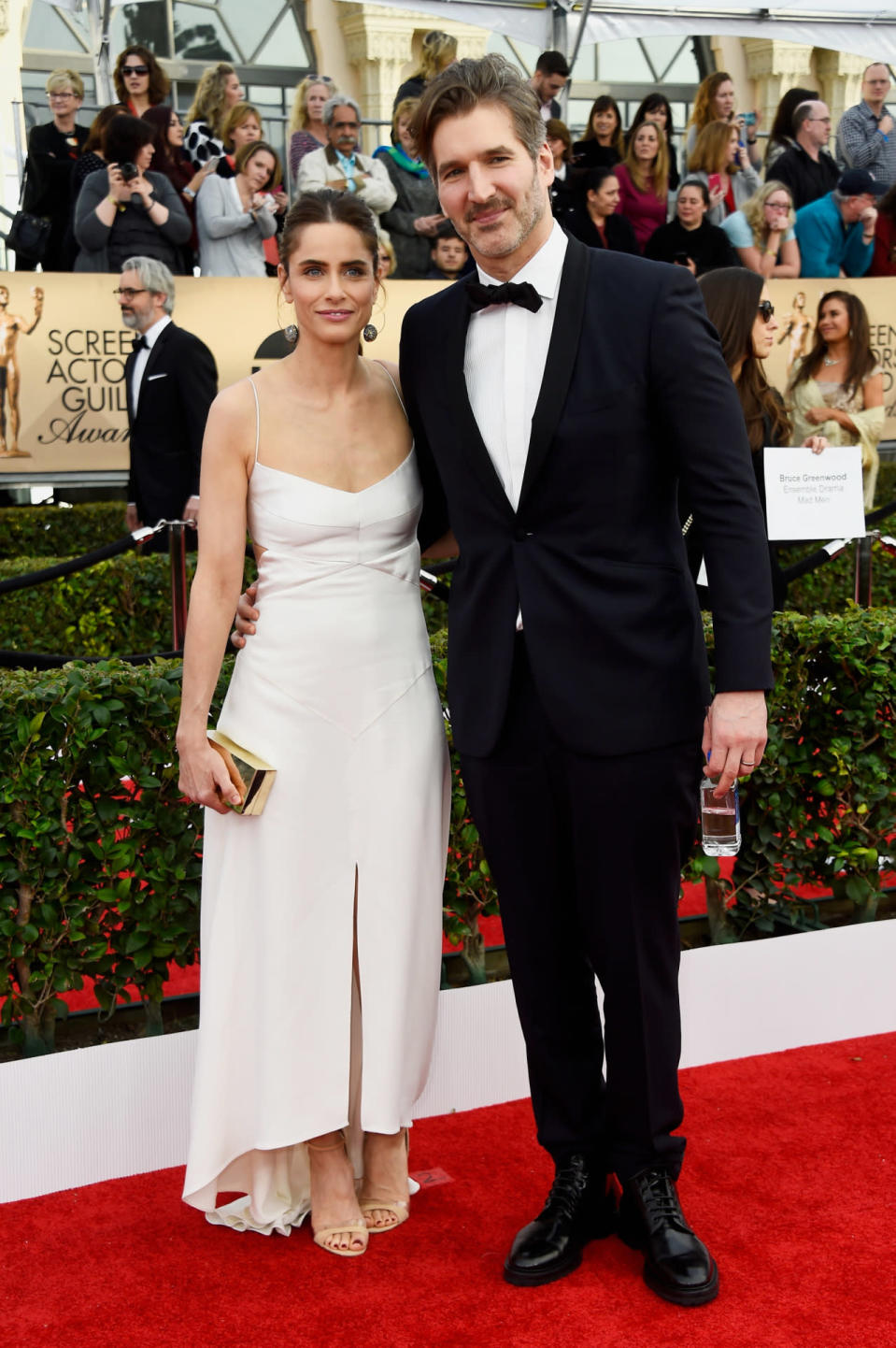 <p>Amanda Peet showed off her nude stillettos in a white midi mullet gown while posing with husband, David Benioff of <i>Game of Thrones</i> fame, on the red carpet. <i>Photo: Getty Images</i></p>