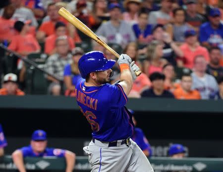 Aug 15, 2018; Baltimore, MD, USA; New York Mets catcher Kevin Plawecki (26) hits a grand slam in the sixth inning against the Baltimore Orioles at Oriole Park at Camden Yards. Mandatory Credit: Evan Habeeb-USA TODAY Sports