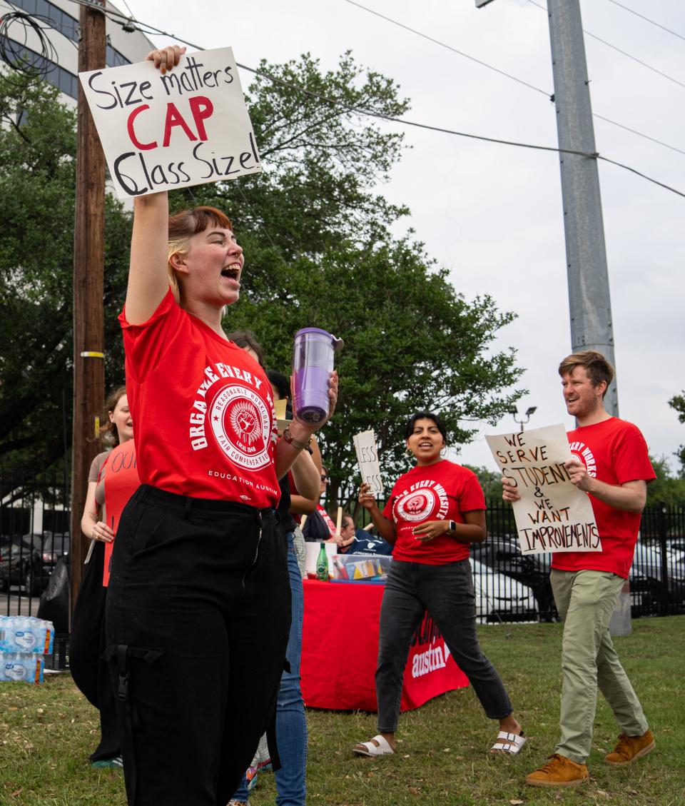 Grace Carriker-Cavin, a second grade teacher at Pleasant Hill Elementary, marches during a rally for pay raises held by Education Austin, the union for Austin district employees, ahead of the school board meeting Thursday.