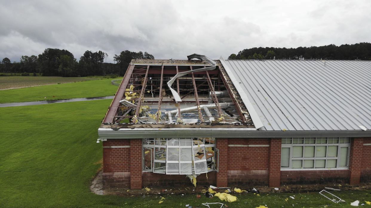 Debris from a tornado triggered by Debby litters the campus of Springfield Middle School in Lucama, N.C., on Thursday.